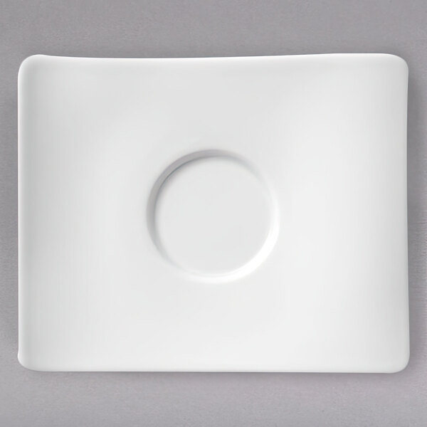 A white Villeroy & Boch NewWave saucer with a circular center on a white surface.