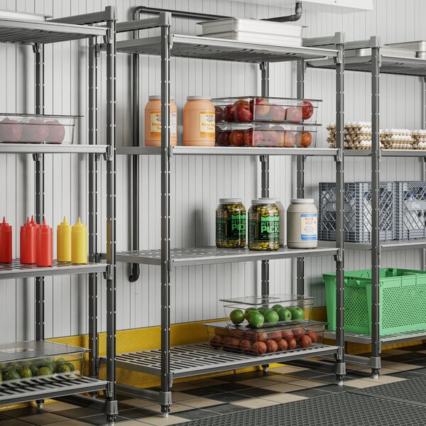 A metal shelving unit with four vented shelves used for storage in commercial kitchens or pantries.