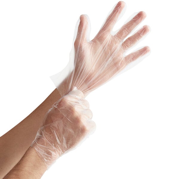 A person wearing a small Choice plastic glove.