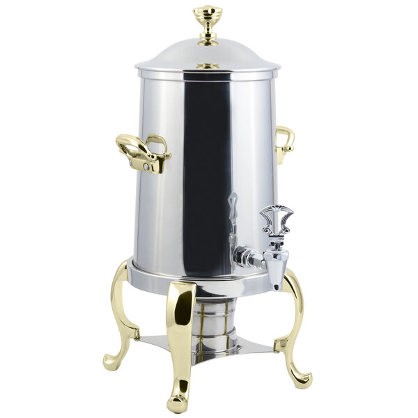 A stainless steel Bon Chef coffee chafer urn with brass trim.