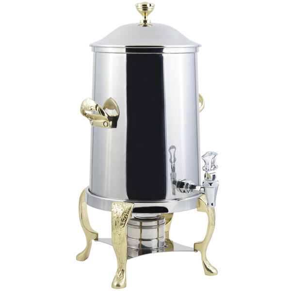 A stainless steel Bon Chef coffee chafer urn with brass trim.