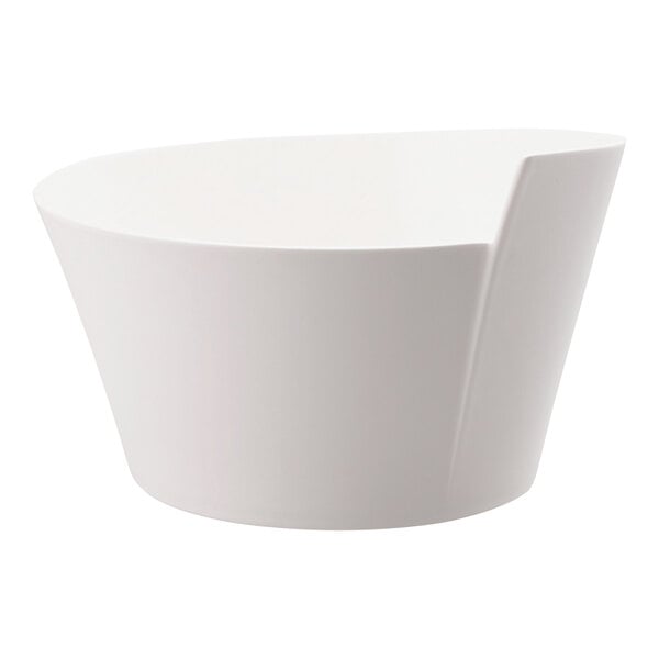 A Villeroy & Boch NewWave white porcelain salad bowl with a curved edge.