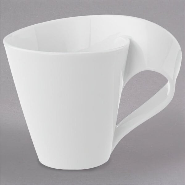 A Villeroy & Boch white porcelain coffee cup with a curved handle.