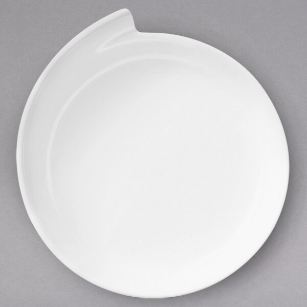 A white Villeroy & Boch NewWave porcelain plate with a curved edge.