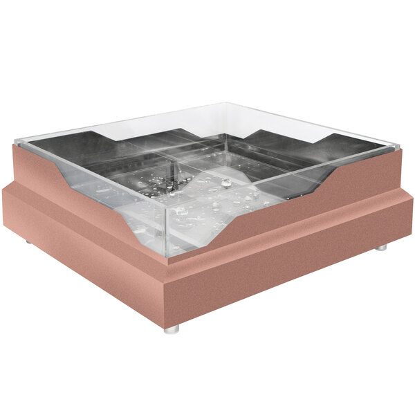 A square copper coated stainless steel raw bar with wave design on a table in a cocktail bar.