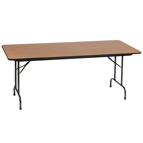 A Correll rectangular medium oak folding table with a black frame.