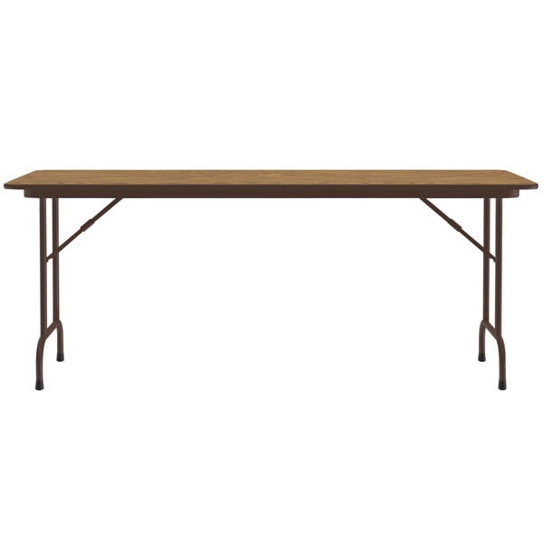 A Correll rectangular medium oak folding table with metal legs.