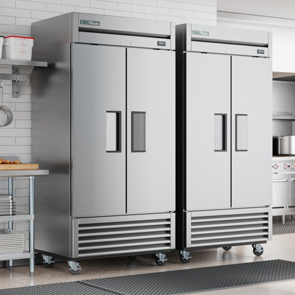 A True T-35F-HC reach-in freezer with a solid door in a kitchen.