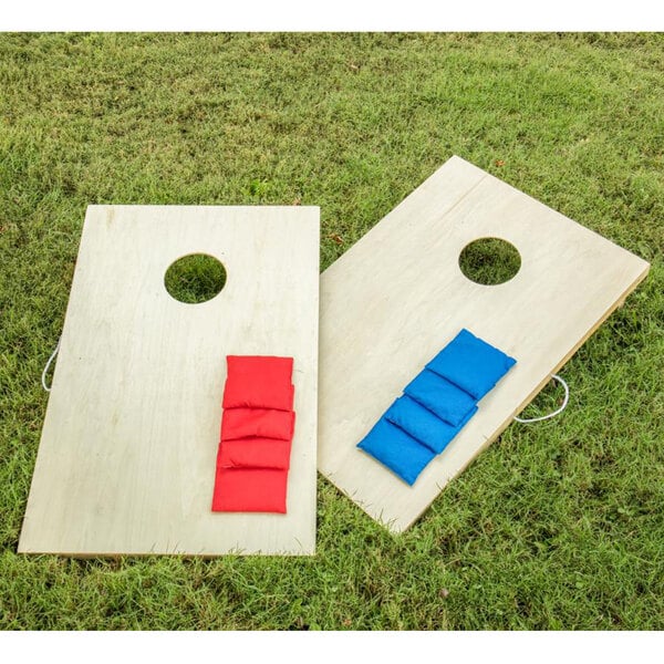 two cornhold boards with red and blue sacks