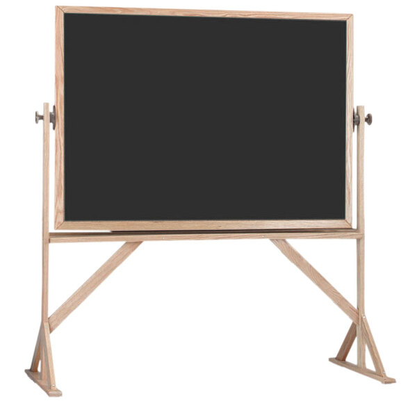 A black board with a wooden frame on a stand.