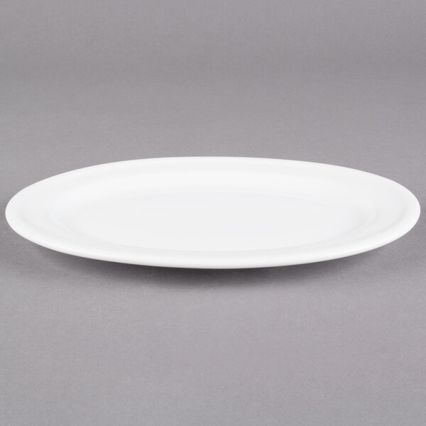 An Alpine White porcelain oval platter with a rim.