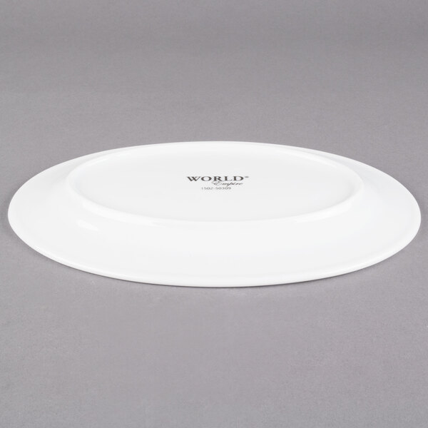 A white Libbey porcelain platter with black text reading "Empire" on a gray surface.