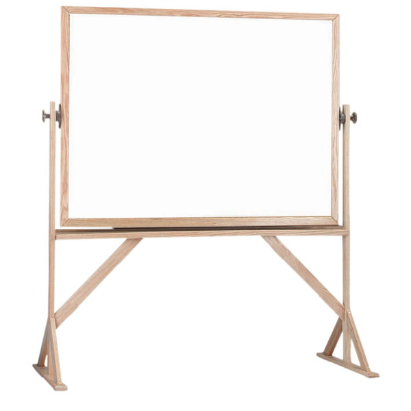 A white board with a wooden frame on a stand.