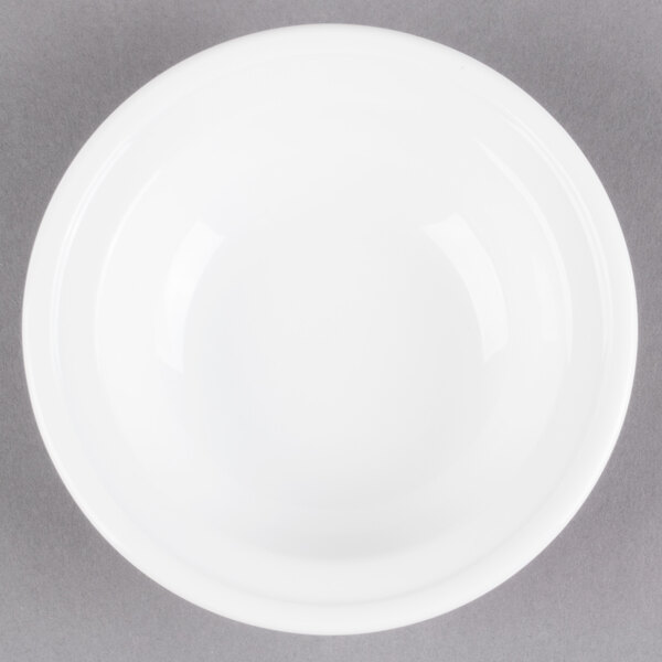 A Libbey alpine white porcelain fruit bowl on a white surface.