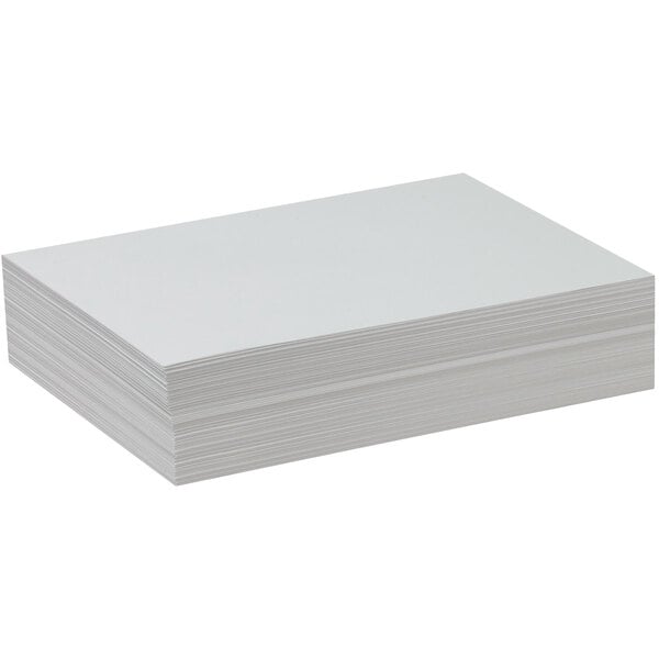 A stack of Pacon white drawing paper.