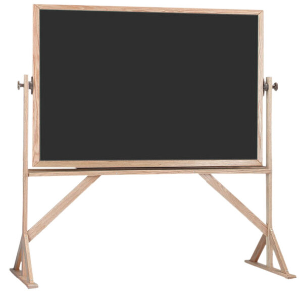 A black board with a wooden frame on a stand.