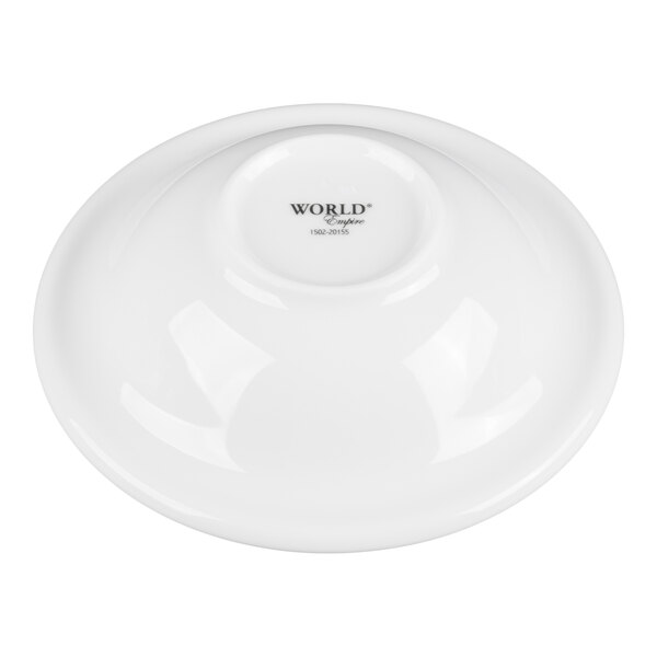 A white, round porcelain bowl with a slightly raised center and the words 'WORLD Empire' printed in the middle.