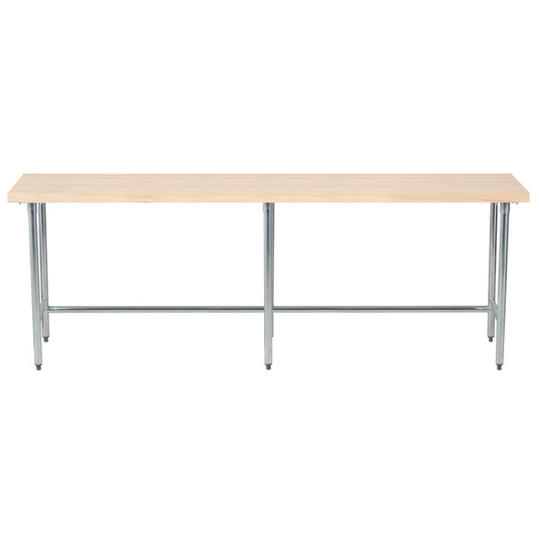 An Advance Tabco wood top work table with a galvanized metal base.