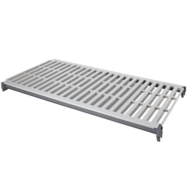 A white metal grate with holes.