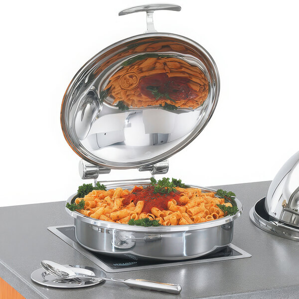 A Vollrath stainless steel chafing dish with pasta and sauce in a stainless steel food pan.