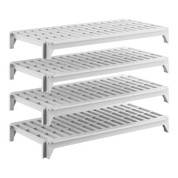 A set of four white vented plastic shelving units designed for modular storage.