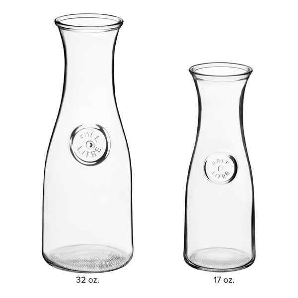 Two clear Acopa Glass Carafes.