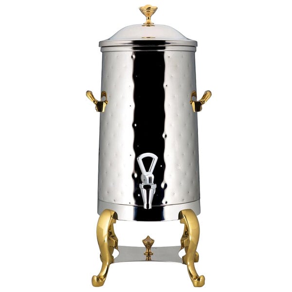 A stainless steel Bon Chef coffee chafer urn with brass trim.
