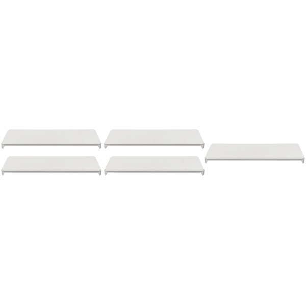 A row of four white shelves on a white background.