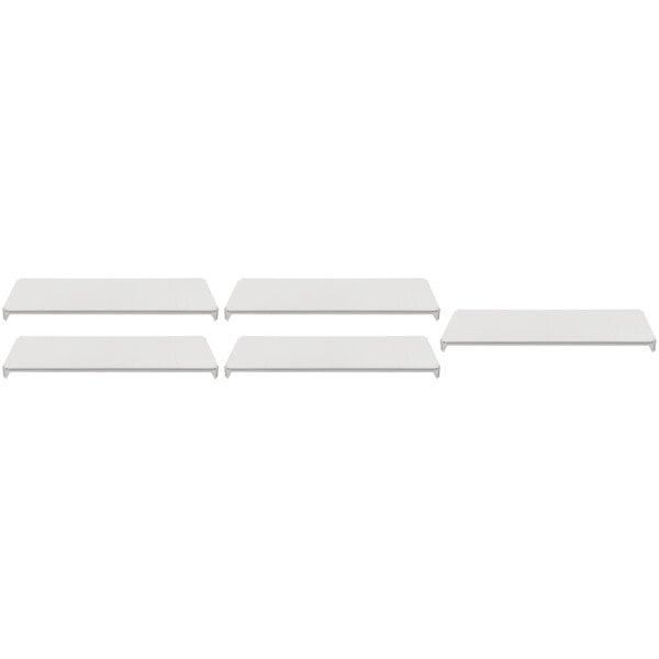 Several white shelves on a white background.