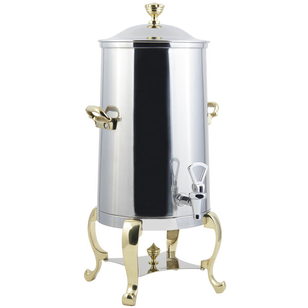 A stainless steel Bon Chef coffee chafer urn with brass trim.