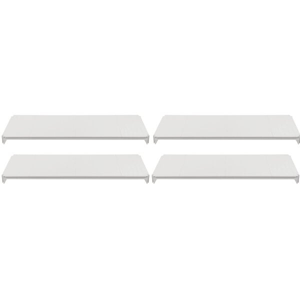 Three white shelves on a white rectangular object.