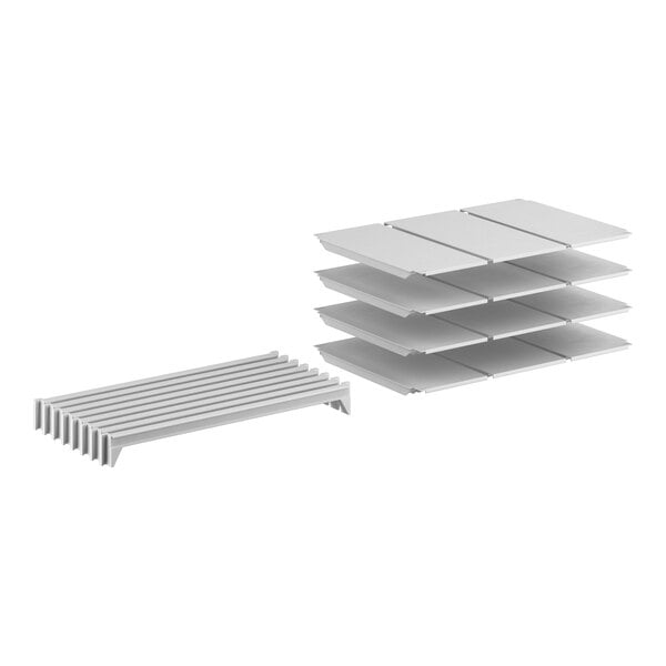 A stack of white Cambro Camshelving® Premium shelves.