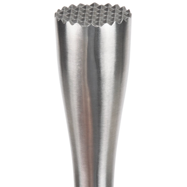 A close-up of a Franmara stainless steel muddler with a tenderizer head on a table.