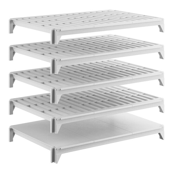 A set of five white shelving units, including one solid shelf and four vented shelves, designed for modular storage.