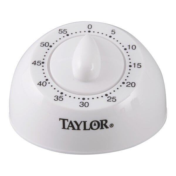 A white Taylor 5832 mechanical 60 minute kitchen timer with black numbering and a central dial.