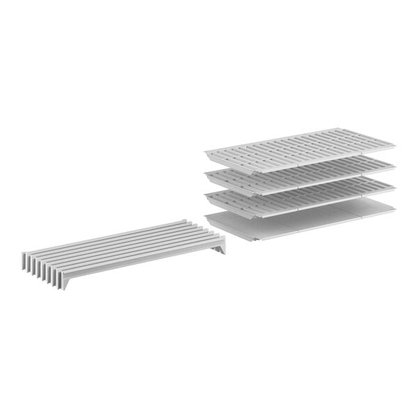 A white rectangular object with three white plastic shelves on it.
