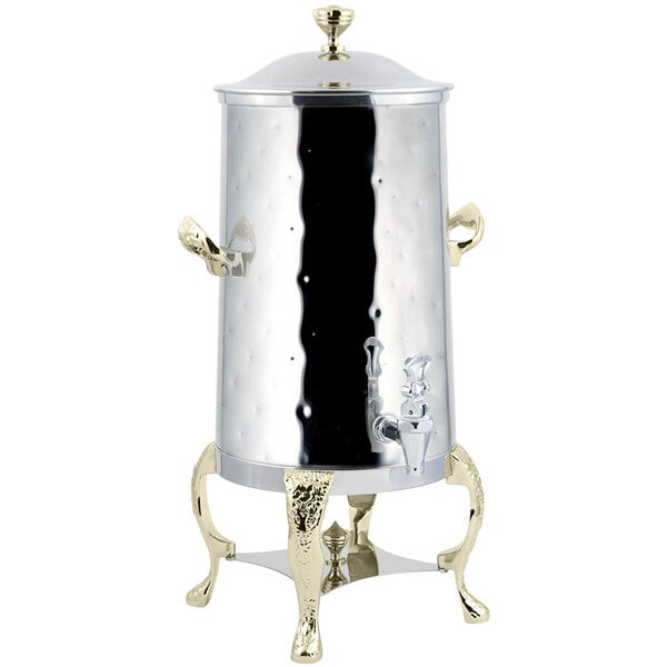 A silver and gold Bon Chef electric coffee chafer urn with a stand.