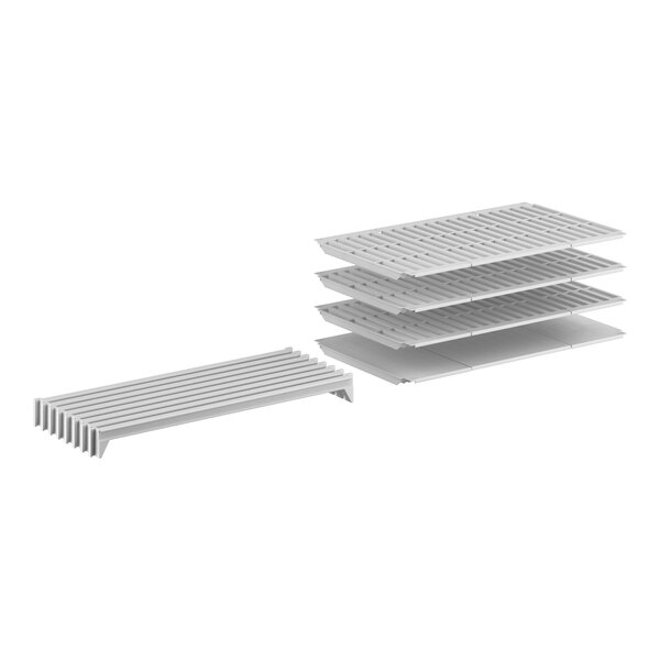 A stack of white Cambro Camshelving Premium shelves with 1 solid and 3 vented shelves.