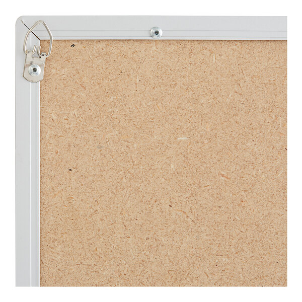 An Aarco black slate composition chalkboard with an aluminum frame.