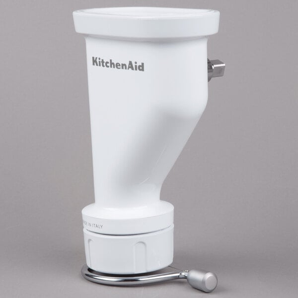 A white KitchenAid pasta press attachment with a handle.