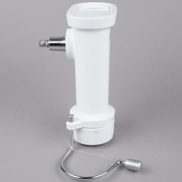 A white plastic KitchenAid attachment with a metal handle.