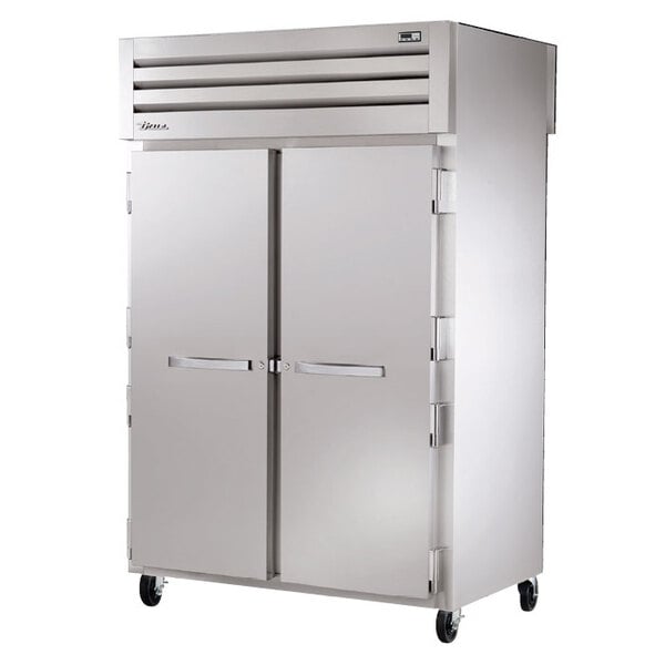 A True Spec Series pass-through heated holding cabinet with two solid doors.