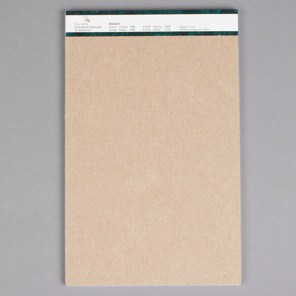A white paper with green trim from TOPS Docket Writing Tablet.