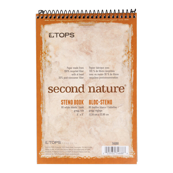 A spiral-bound steno pad with a marbled beige and orange cover featuring the text 'second nature' and product details printed on the front.