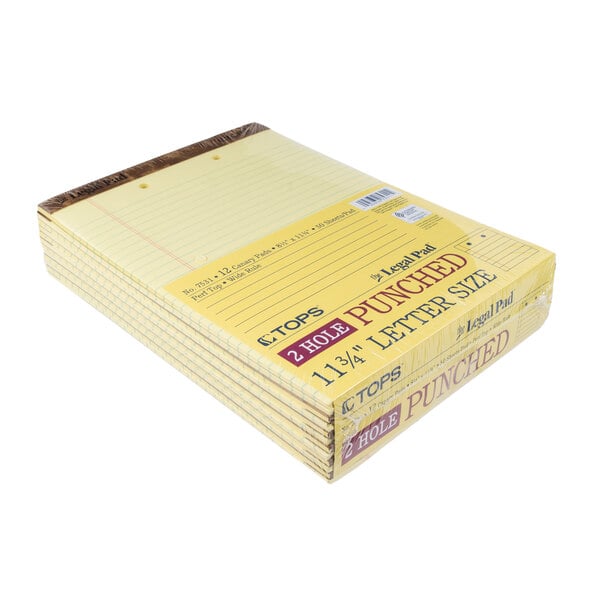 A stack of TOPS 2-hole punched wide ruled legal pads with yellow lined paper.