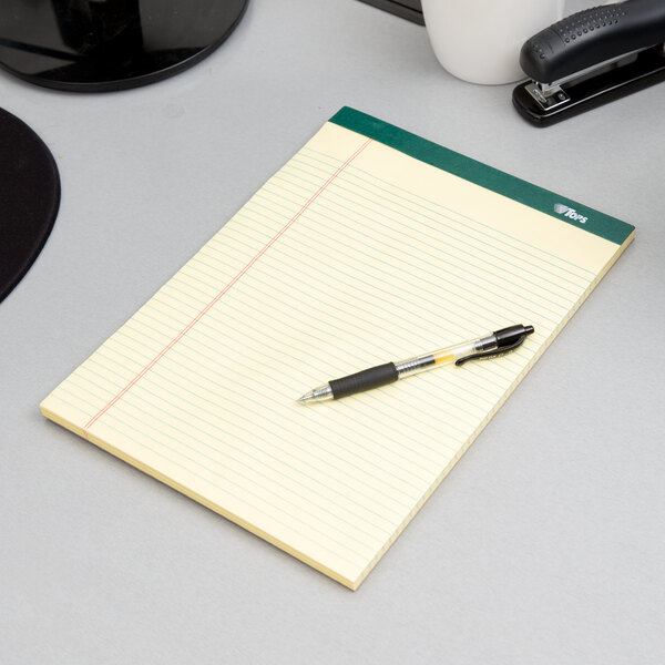 A pen on a TOPS narrow ruled canary writing pad.