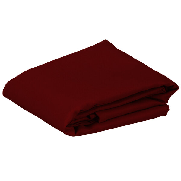 A folded red table cover on a white background.