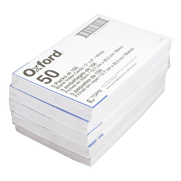A stack of white unruled index cards with packaging labeled 'Oxford 50' and details about the product.