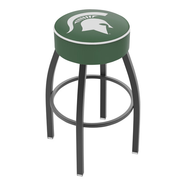 A Holland Bar Stool Michigan State University swivel bar stool with a green seat.