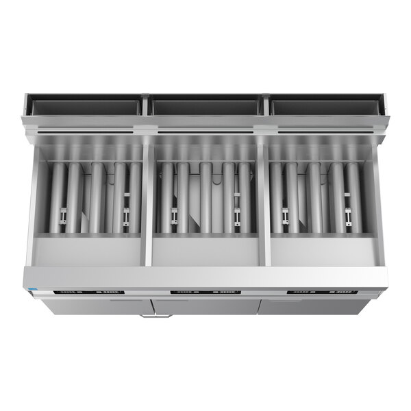 A commercial three-unit floor fryer system with digital controls and filtration system.